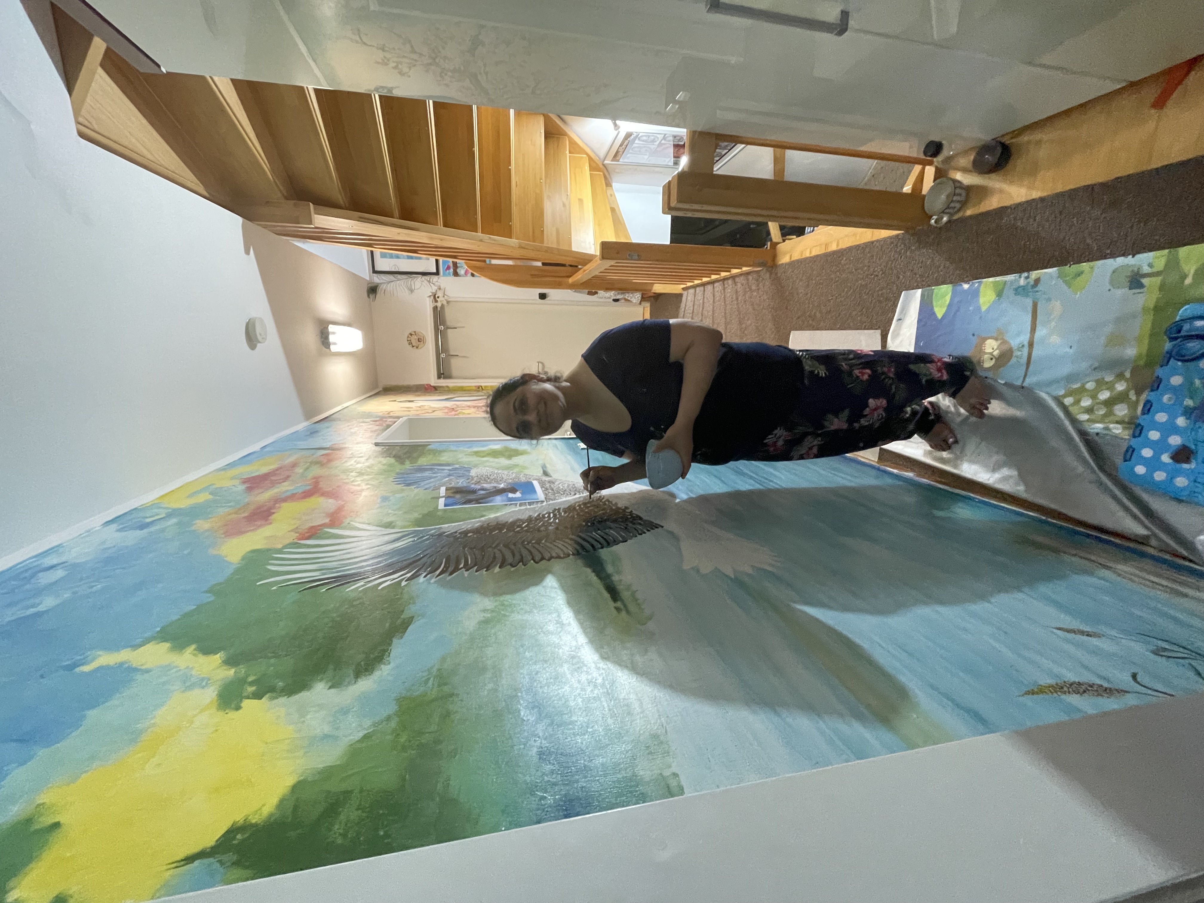 Sukhada painting the Air mural